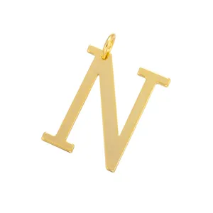 Detailed close-up of the elegant gold letter N metal pendant, showing polished surface.