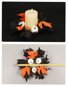 Detailed view of Halloween candle ring with black orange maple leaves and white pumpkins decor.