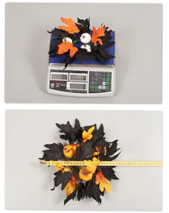 Halloween candle ring decoration with black maple leaves and pumpkins for display.