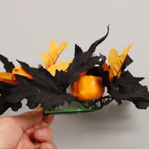 Halloween candle ring with black and orange maple leaves and pumpkin decoration for autumn party