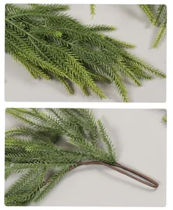 Artificial Norfolk pine branch detail shot, green PE pine needles and brown flexible stem.