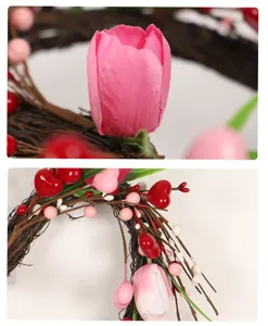 Detail shot of artificial tulip flower wreath with red heart berries for wall decor.