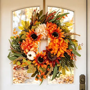 Herfst kunstmatige zonnebloem krans met pompoenen en bessen voor voordeur en herfst decoratie.