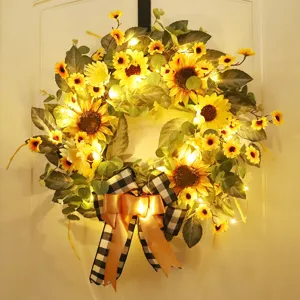 Couronne de tournesol artificielle avec nœud et lumières LED pour décoration printanière.