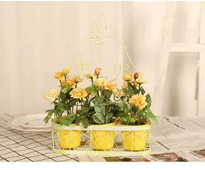 American pastoral style wall-hanging iron flower basket with yellow artificial roses.
