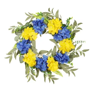 Artificial hydrangea wreath with blue yellow flowers and green eucalyptus leaves for spring decor
