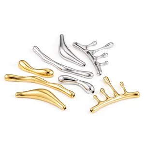 Detailed shot of irregular melted style stainless steel DIY jewelry pendants in gold and silver.