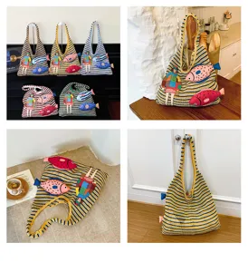 Casual knitted stripe shoulder tote bag featuring cute fish and doll appliques detail.