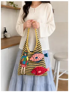 Handmade woven knit shoulder bag with cute fish and girl embroidery details for daily use.