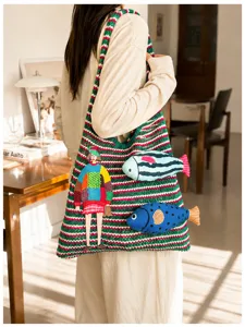 Casual knitted tote bag with colorful stripes and fish embroidery, stylish shoulder bag for women.