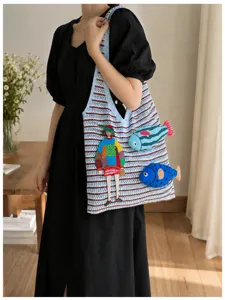Casual knit woven shoulder bag featuring cute embroidered girl and fish design for women.