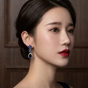 Blue sapphire cubic zirconia teardrop flower earrings detail view for elegant bridal party