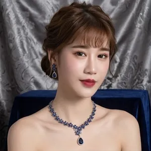 Stunning blue sapphire zircon teardrop necklace and earrings set for bridal evening party wear.