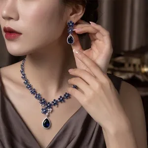 Exquisite blue cubic zirconia teardrop necklace and earrings set for bridal evening party.