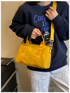 Yellow canvas travel shoulder bag, casual large capacity tote for women daily commute.