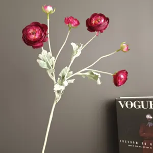 Artificial ranunculus flower stem detail shot, dark pink floral decor for home and wedding.
