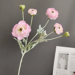 Detail shot of artificial 6-head pink ranunculus flower branch for home decor and photography