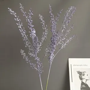 Detailed shot of artificial purple fruit branch, elegant floral decor accessory for home.