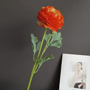 Close-up detail of artificial ranunculus flower with natural touch for home decor staging.