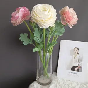 Artificial ranunculus flowers bouquet in clear glass vase for home interior decor prop