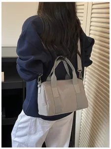 Grey nylon casual shoulder bag detail, stylish women's crossbody Boston handbag for daily commute.