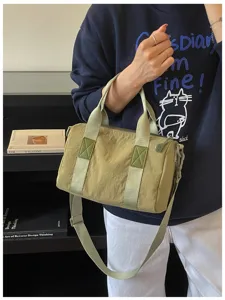 Casual khaki barrel shoulder bag detail, lightweight daily crossbody handbag for women.