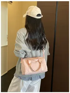 Lightweight solid pink women's shoulder bag, large capacity travel crossbody handbag.