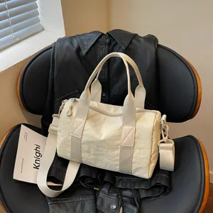 Versatile commuter travel bag, large capacity crossbody bag, lightweight solid color shoulder bag.