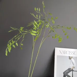 Artificial green oat grass leaf branches for Nordic home decor floral arrangement design.