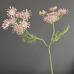 Close-up detail of artificial pink lace flower branch, perfect for floral arrangement decor.