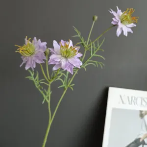 Artificial purple wildflower black cumin decorative flower close-up detail shot display.