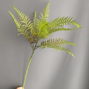 Artificial fern leaf detail, soft rubber green plant branch, ideal for home and floral decor.