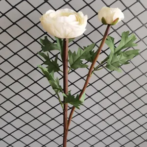 Artificial ranunculus flower detail shot, white 2-head faux peony with green leaves for home.