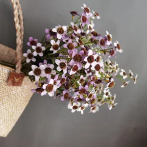 Artificial forget-me-not daisy wild flower bouquet with woven jute bag for home decor and photo props.