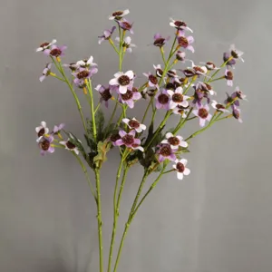 Artificial purple daisy flower bouquet with fuzzy centers for home interior decoration details.