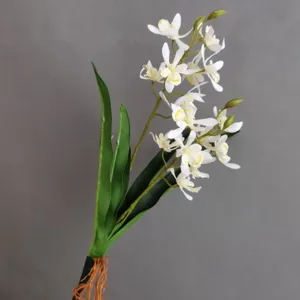 Lifelike artificial orchid flower branch with white blossoms and green leaves for home decor.