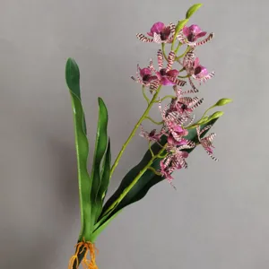 Detailed shot of artificial orchid branch, realistic purple-striped flowers, home decor.