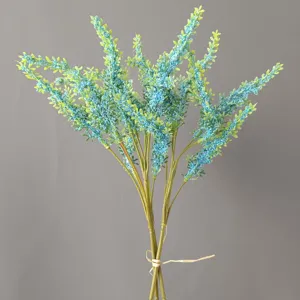 Detailed view of artificial blue faux lavender bouquet, featuring textured stems and twine.