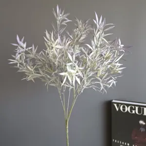 Close-up detail of artificial flocked lucky grass branch for elegant floral design decor.