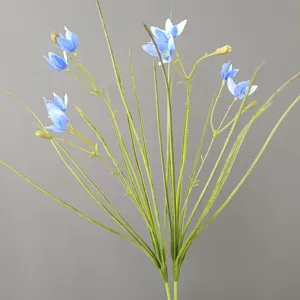 Artificial blue flower detail shot, green stems and leaves, ideal home decor prop.