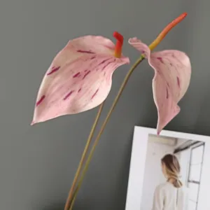 Artificial pink anthurium flower stem with purple spots for home decor and wedding arrangement.