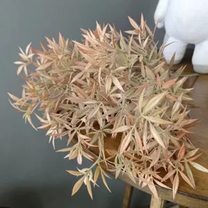 Closeup detail view of artificial flocked pinkish plant bundle, ideal for floral decor.