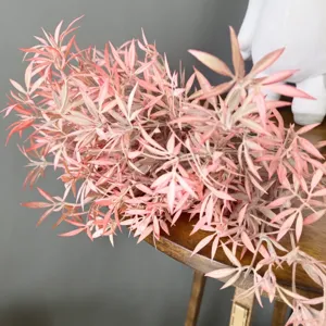 Detail view of artificial pink flocked clover bunch, ideal for home floral arrangement & decor.