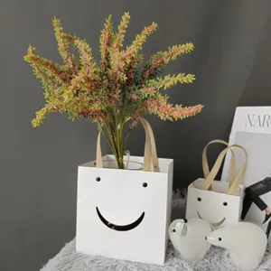 Artificial lavender sage floral arrangement in Nordic style white smiley vase decor.