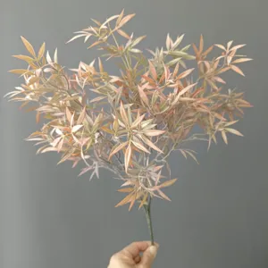 Artificial plant branch detail shot, 5-fork flocked clover with pink tint for floral decor.