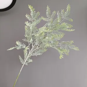 Artificial fern leaf branch detail, perfect for home decor, floral arrangement and interior design.