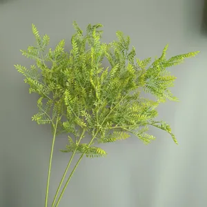 Detailed close-up view of artificial fern leaves stems, perfect for home decor and floral arrangements.