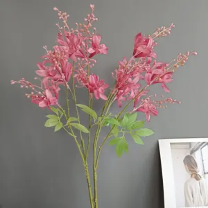 Close-up detail of artificial pink flower branch for home interior decoration and wedding display.
