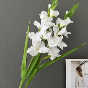 Artificial gladiolus flower stem detail shot, white silk floral decor for home wedding.