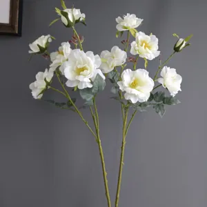 Artificial white rose camellia branch for Nordic home decoration, elegant fake flower detail shot.